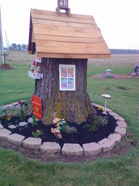 maison de gnome faites de troncs arbres 7